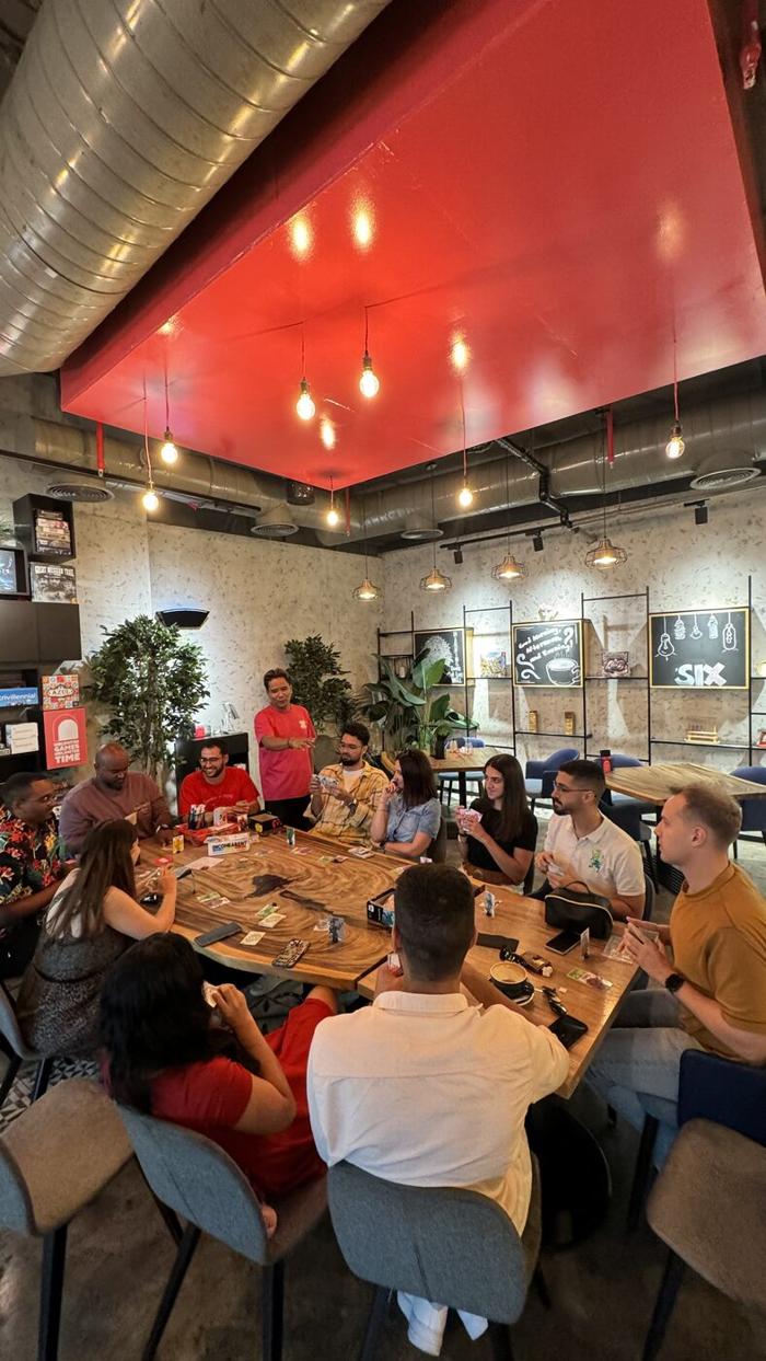 United Expats in UAE board games night around a large table